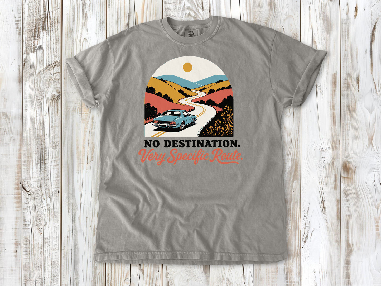 Grey garment-dyed tee with No Destination Very Specific Route Sunday drive graphic.