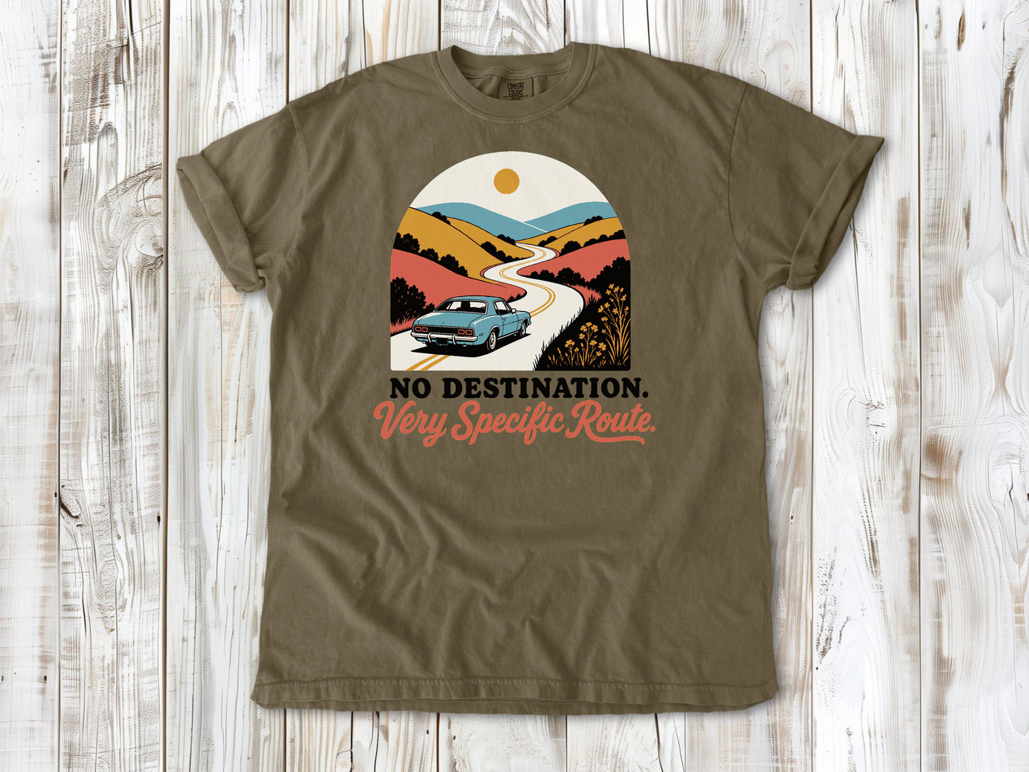 Khaki garment-dyed tee with No Destination Very Specific Route Sunday drive graphic.