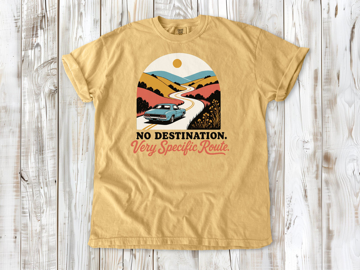 Mustard garment-dyed tee with No Destination Very Specific Route Sunday drive graphic.