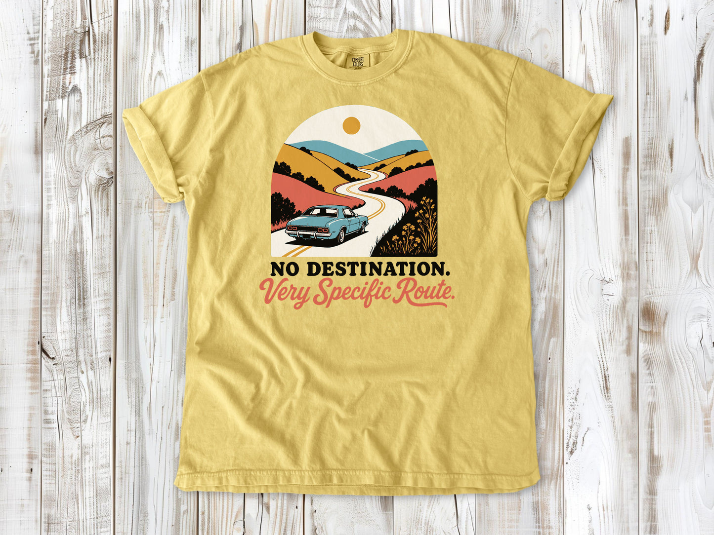 Butter garment-dyed tee with No Destination Very Specific Route Sunday drive graphic.
