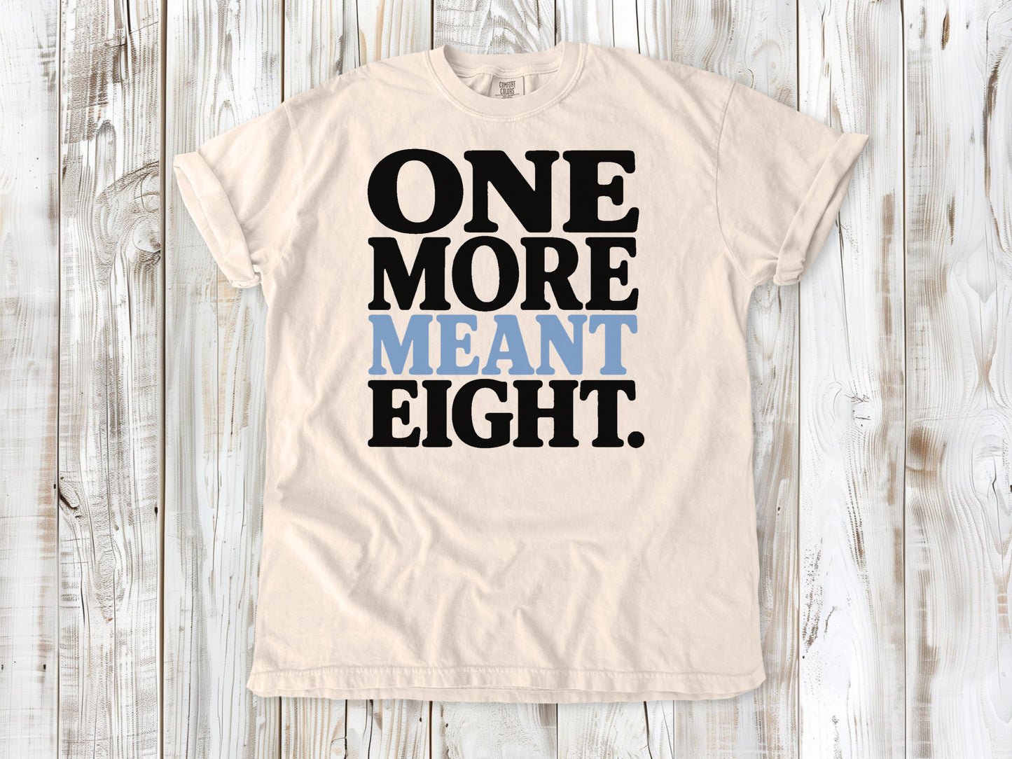 Ivory garment-dyed tee with One More Meant Eight Pilates studio graphic.