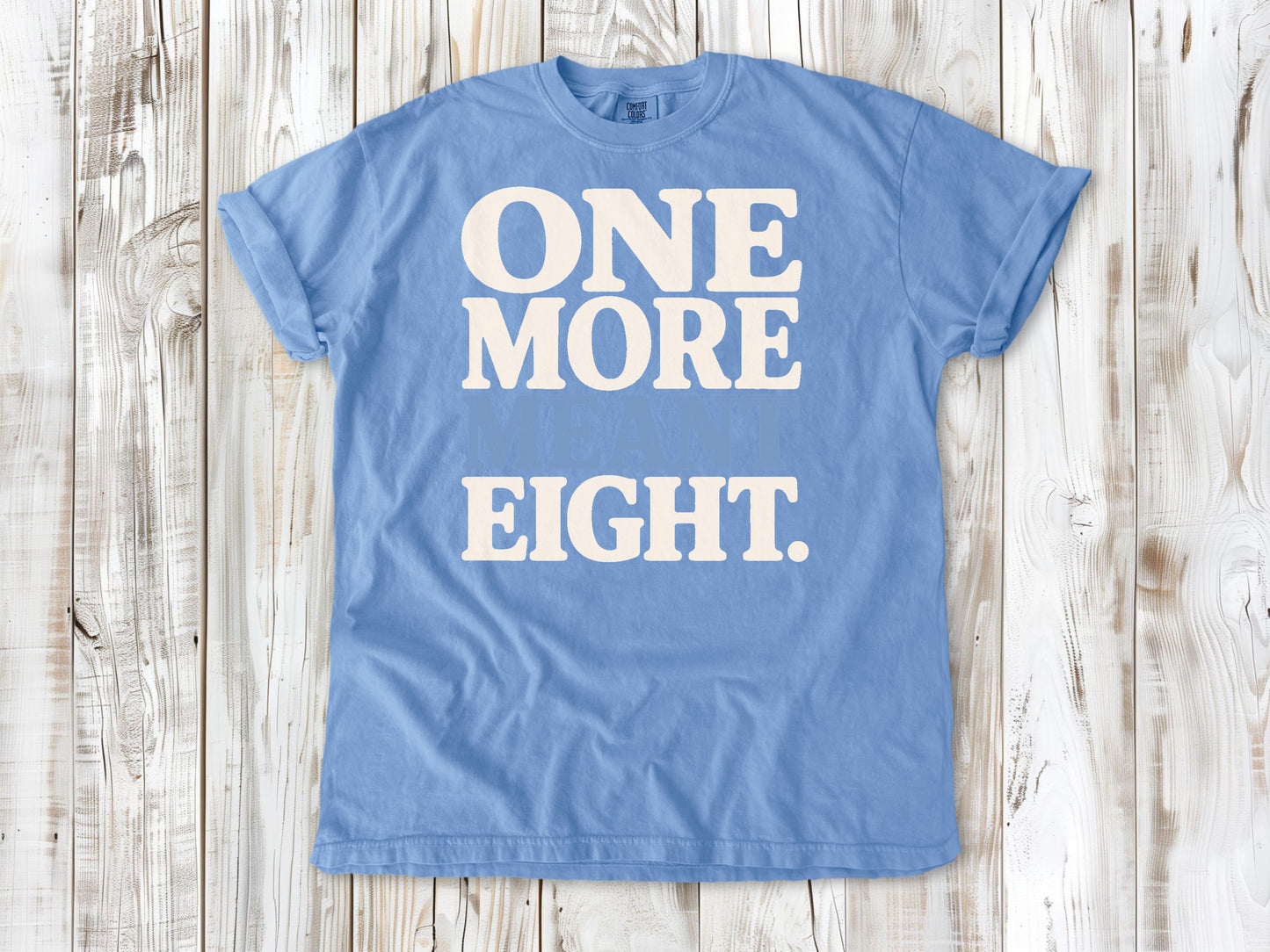 Washed Denim garment-dyed tee with One More Meant Eight Pilates studio graphic.