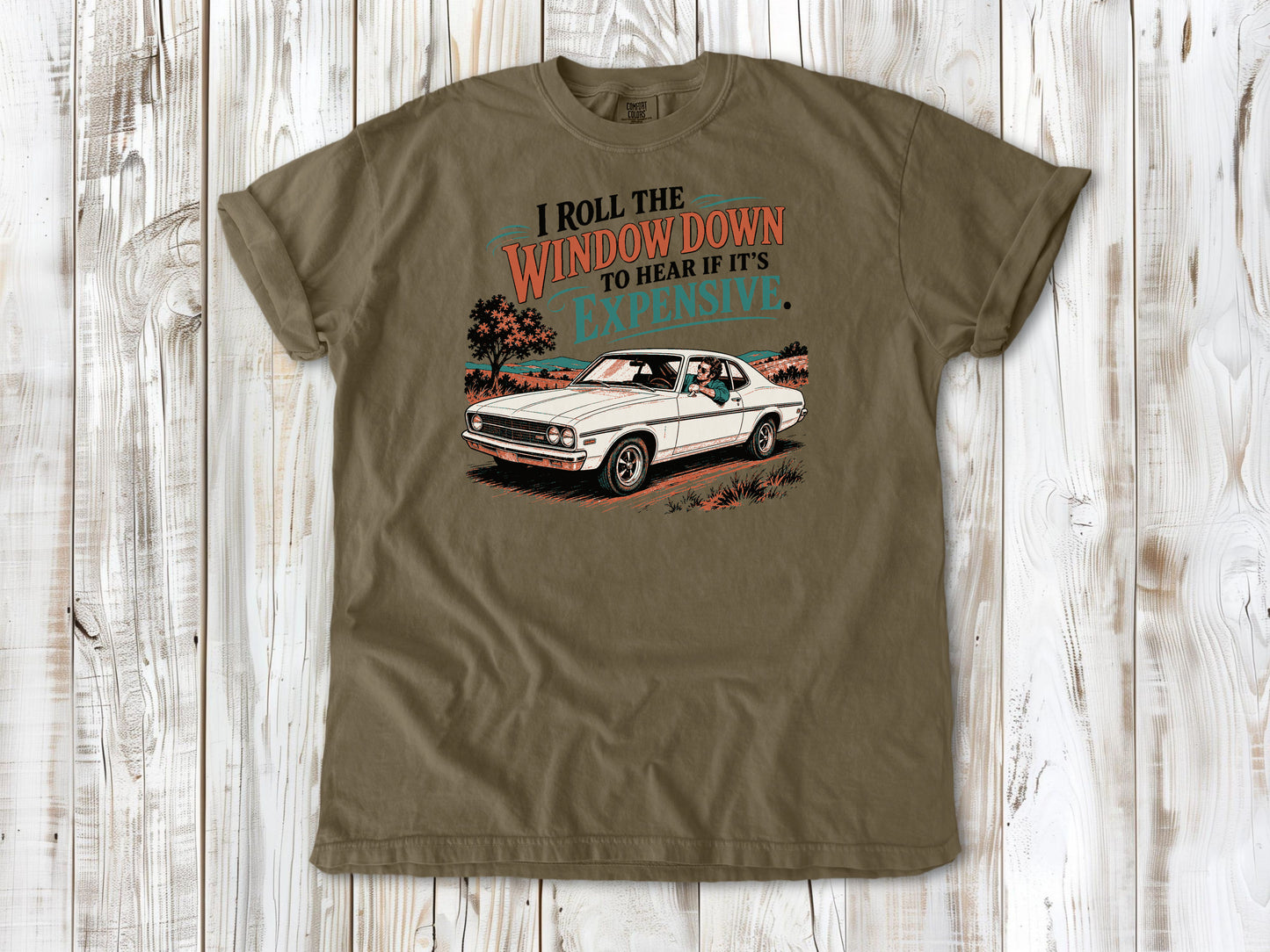 Khaki garment-dyed tee with I Roll the Window Down to Hear If It Is Expensive car repair graphic.