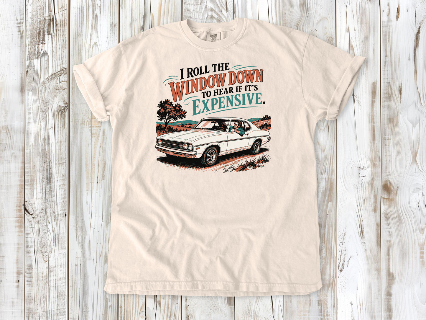 Ivory garment-dyed tee with I Roll the Window Down to Hear If It Is Expensive car repair graphic.