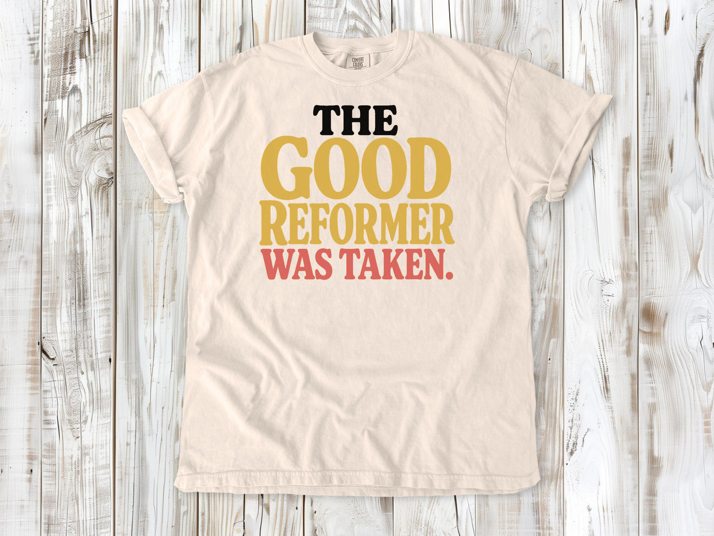 Ivory garment-dyed tee with The Good Reformer Was Taken Pilates studio graphic.