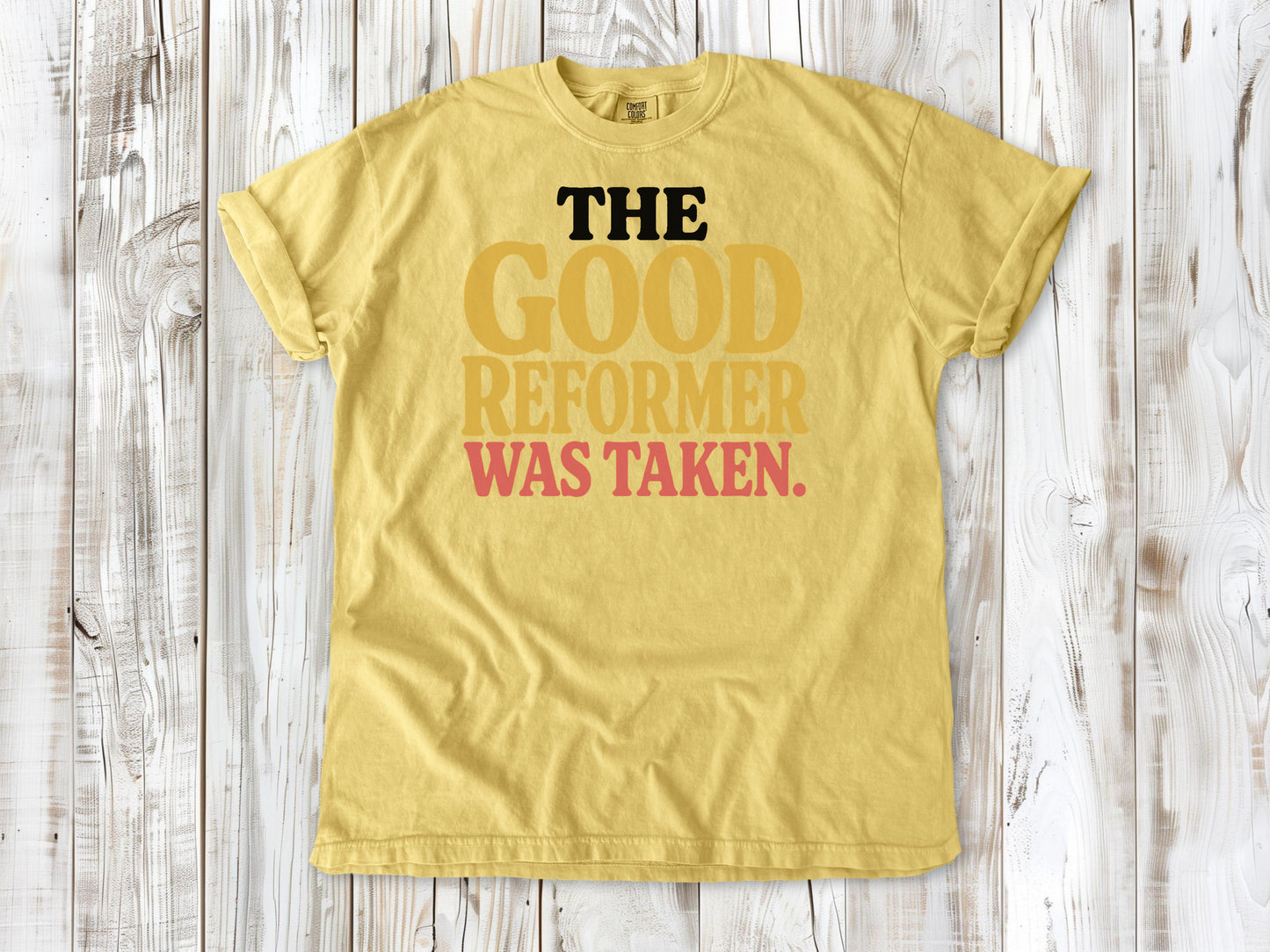 Butter garment-dyed tee with The Good Reformer Was Taken Pilates studio graphic.