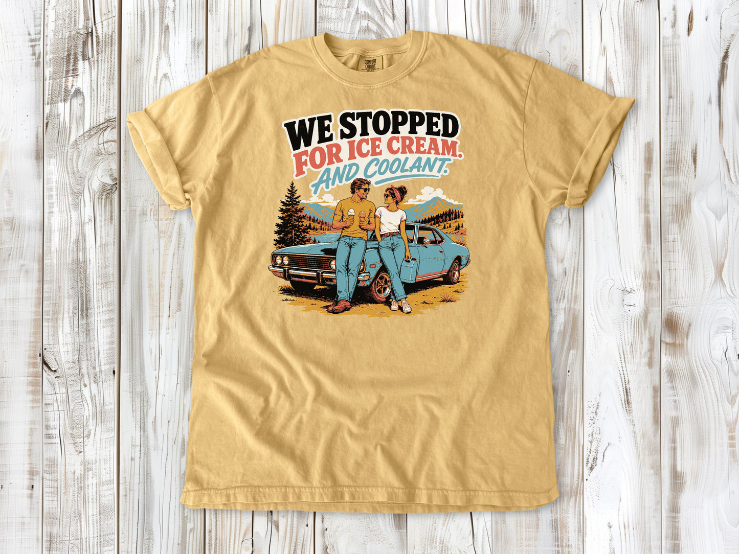 Mustard garment-dyed tee with We Stopped for Ice Cream and Coolant road trip graphic.