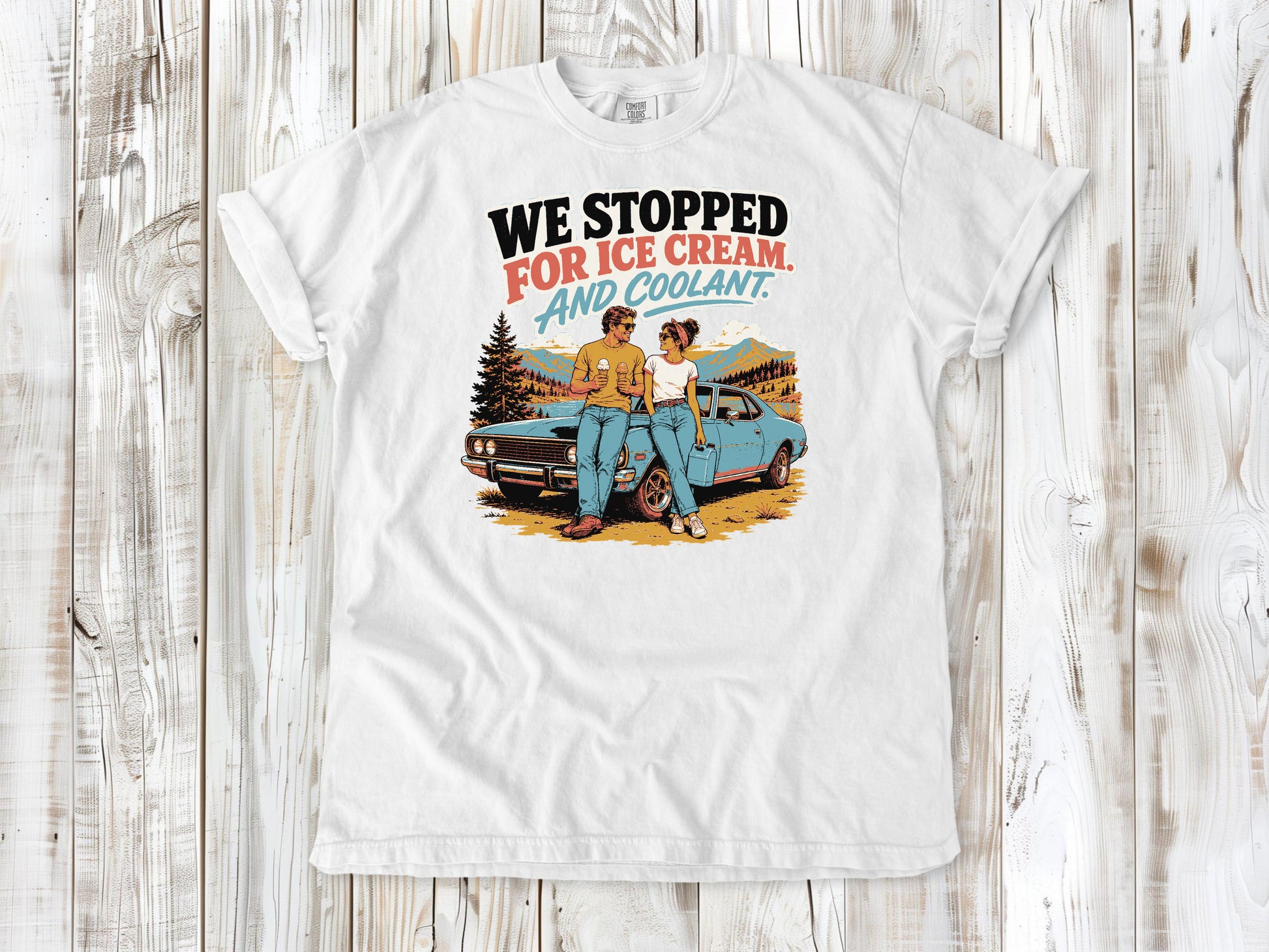 White garment-dyed tee with We Stopped for Ice Cream and Coolant road trip graphic.