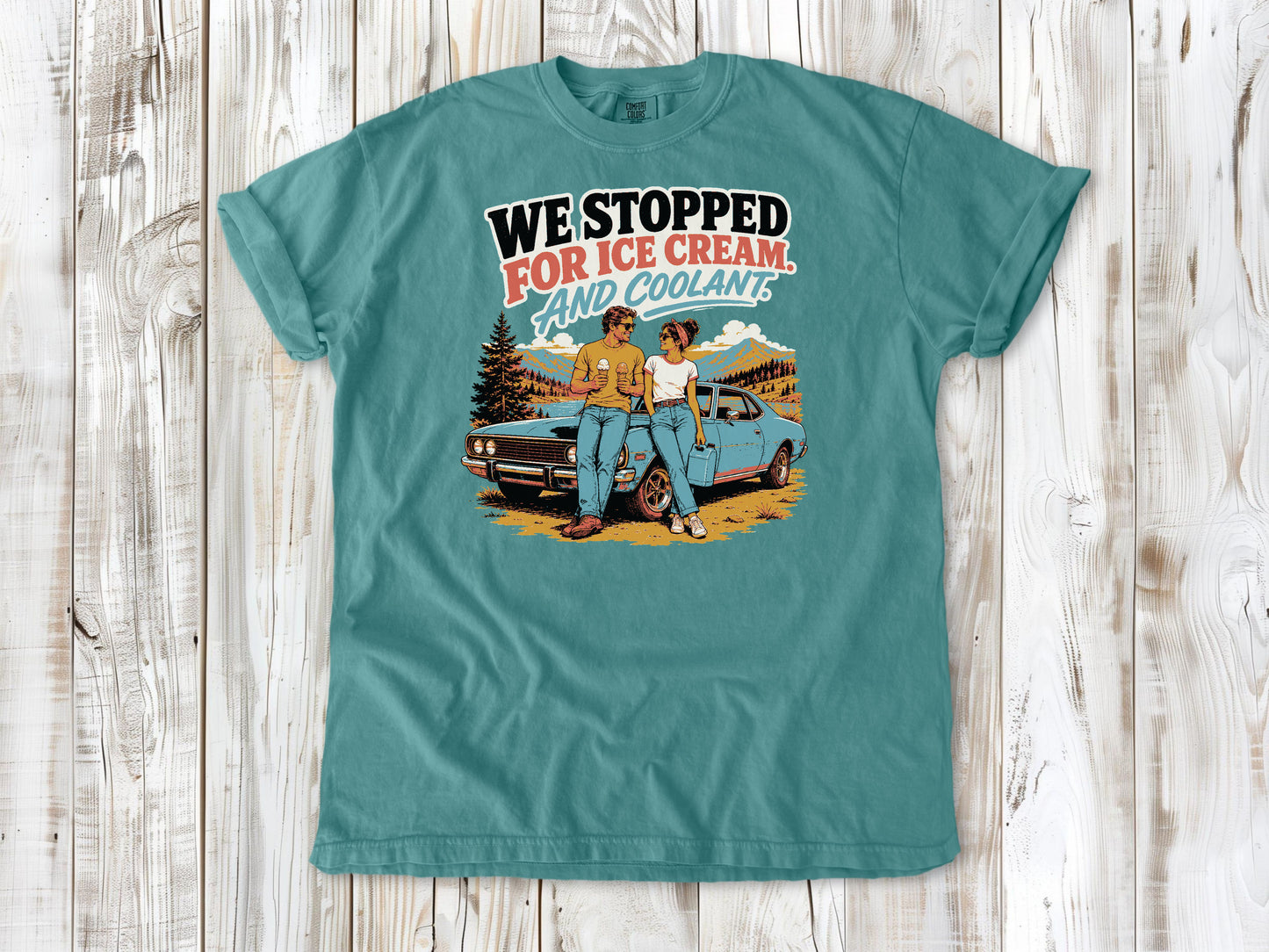 Seafoam garment-dyed tee with We Stopped for Ice Cream and Coolant road trip graphic.