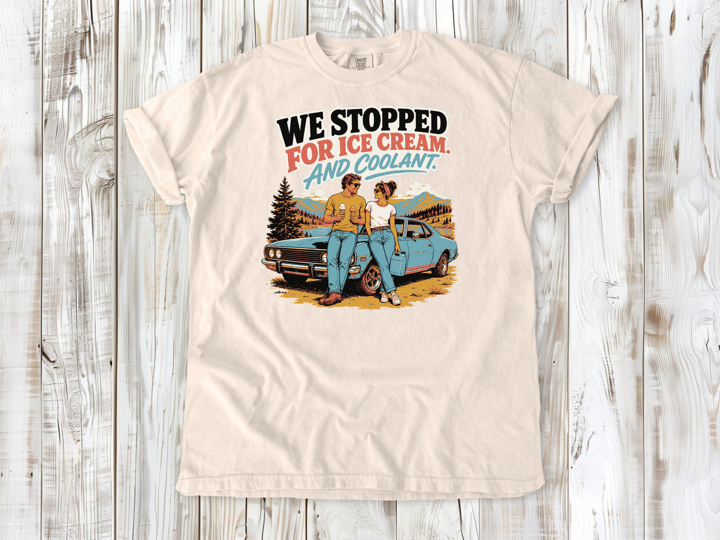 Ivory garment-dyed tee with We Stopped for Ice Cream and Coolant road trip graphic.