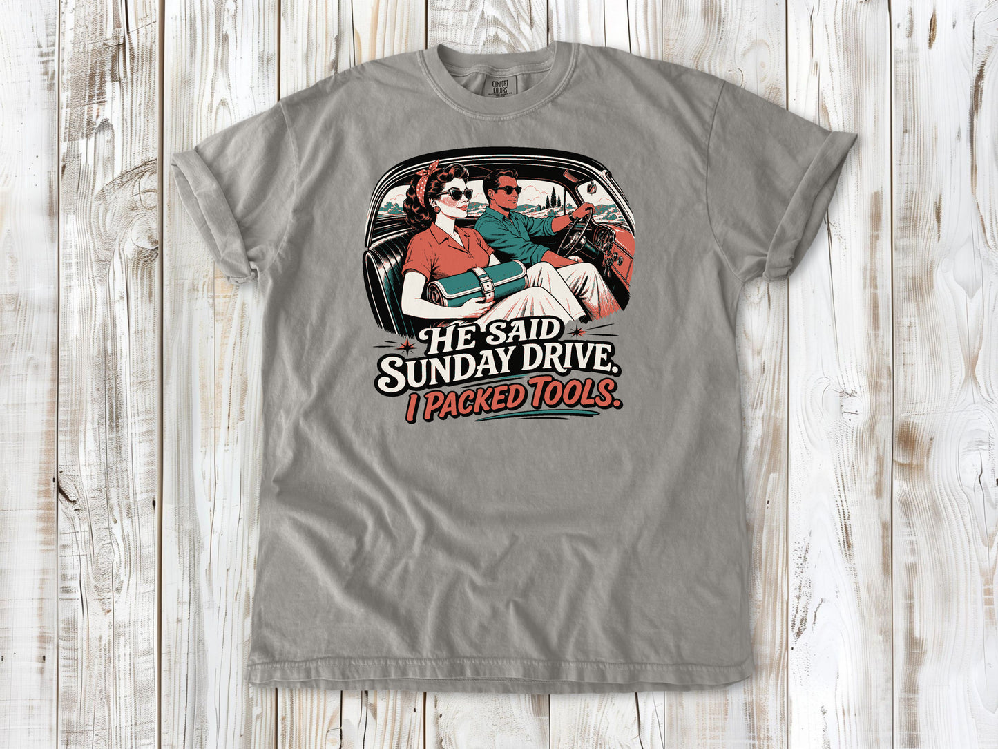 Grey garment-dyed tee with He Said Sunday Drive I Packed Tools classic car graphic.