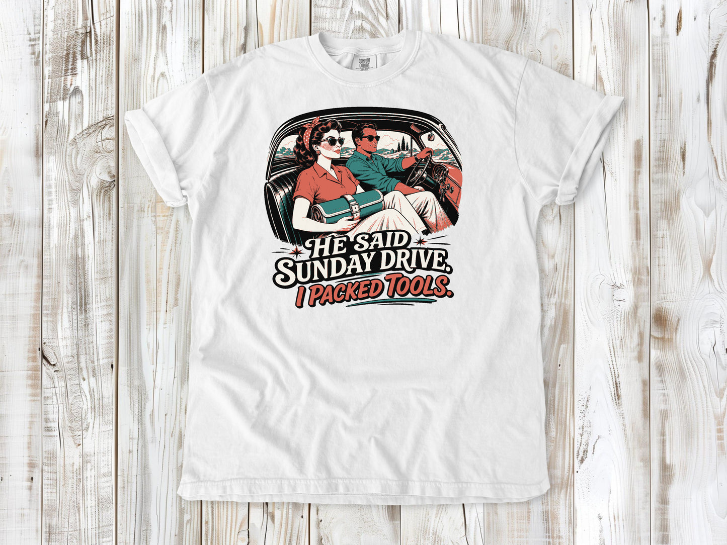 White garment-dyed tee with He Said Sunday Drive I Packed Tools classic car graphic.