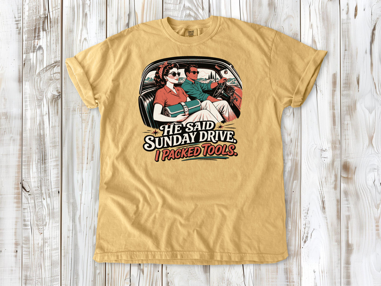 Mustard garment-dyed tee with He Said Sunday Drive I Packed Tools classic car graphic.