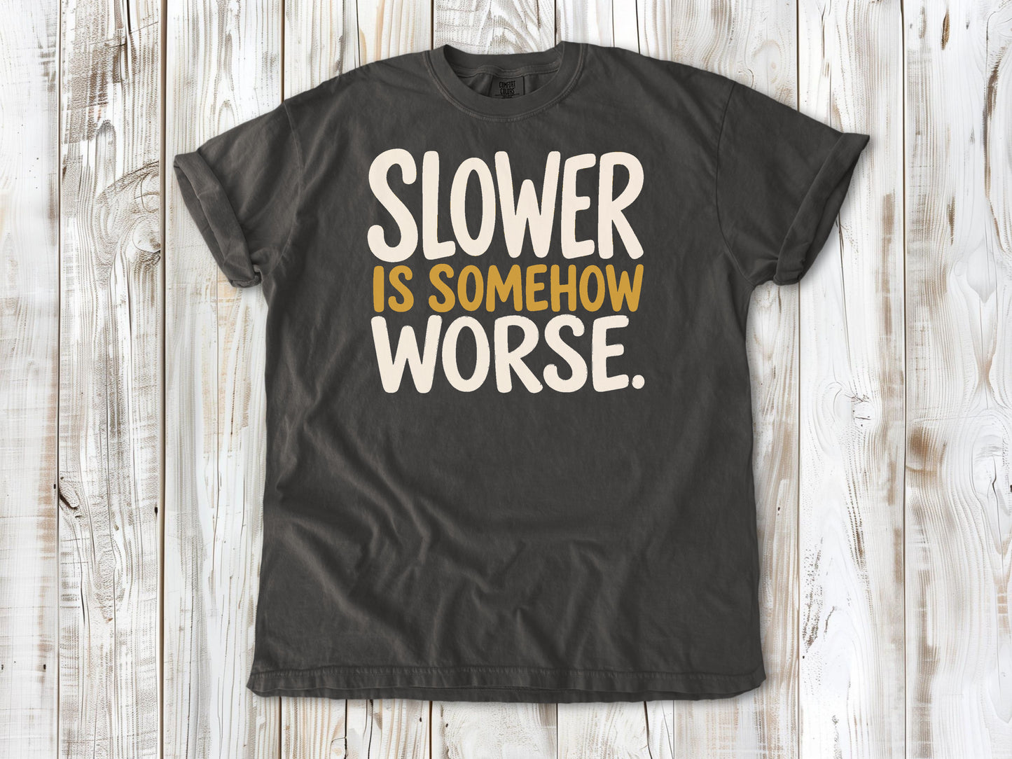 Pepper garment-dyed tee with Slower Is Somehow Worse Pilates workout graphic.