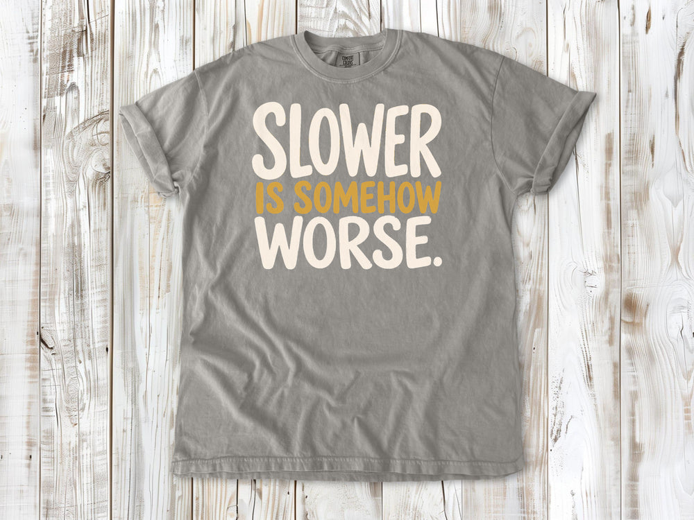 Grey garment-dyed tee with Slower Is Somehow Worse Pilates workout graphic.
