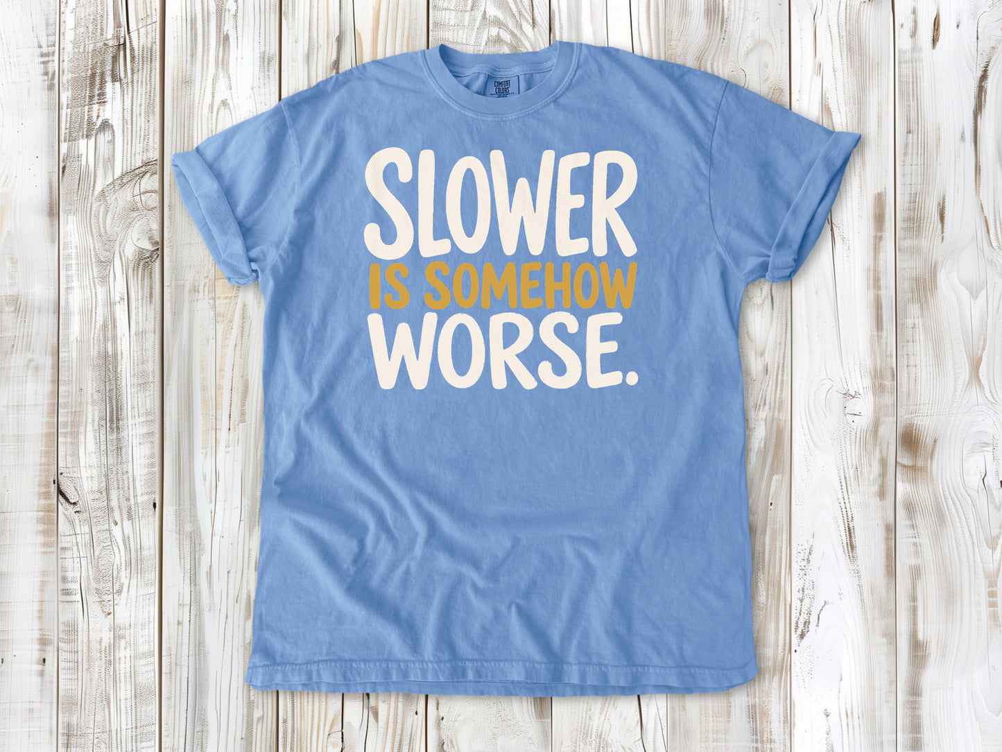Washed Denim garment-dyed tee with Slower Is Somehow Worse Pilates workout graphic.