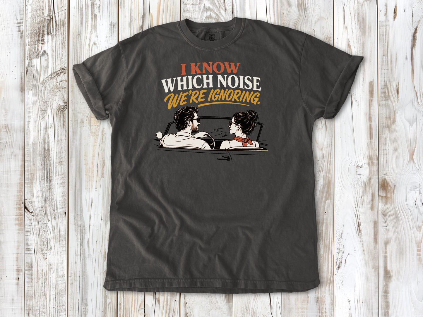 Pepper garment-dyed tee with I Know Which Noise We Are Ignoring car repair graphic.