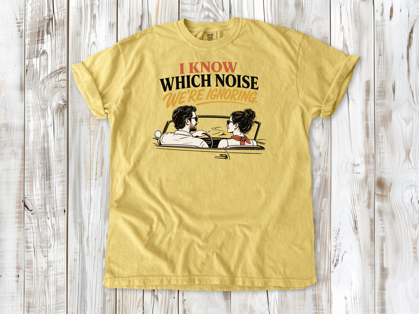 Butter garment-dyed tee with I Know Which Noise We Are Ignoring car repair graphic.