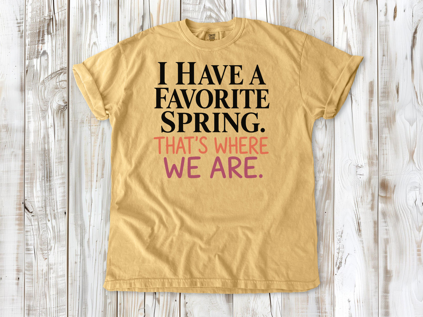 Mustard garment-dyed tee with I Have a Favorite Spring reformer Pilates graphic.