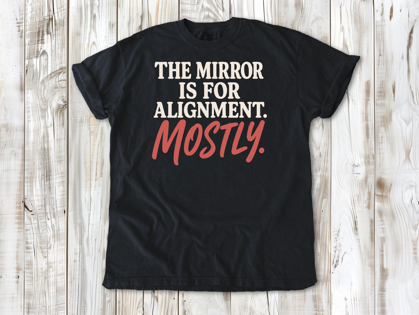 Graphite garment-dyed tee with The Mirror Is for Alignment Mostly Pilates studio graphic.
