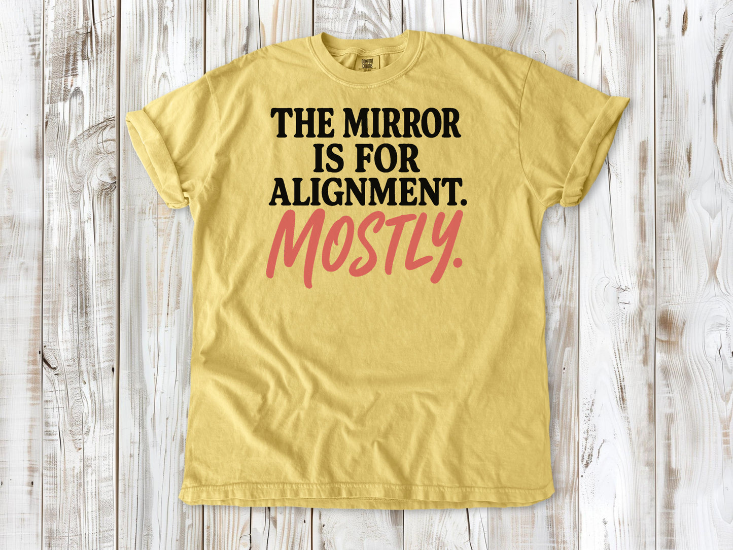 Butter garment-dyed tee with The Mirror Is for Alignment Mostly Pilates studio graphic.