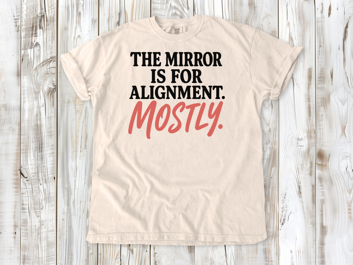 Ivory garment-dyed tee with The Mirror Is for Alignment Mostly Pilates studio graphic.