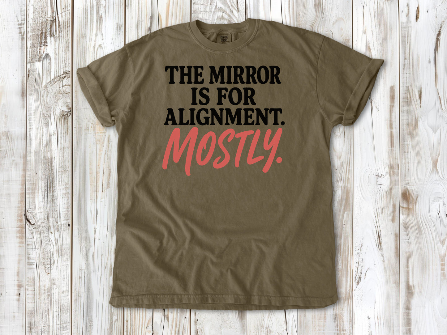 Khaki garment-dyed tee with The Mirror Is for Alignment Mostly Pilates studio graphic.