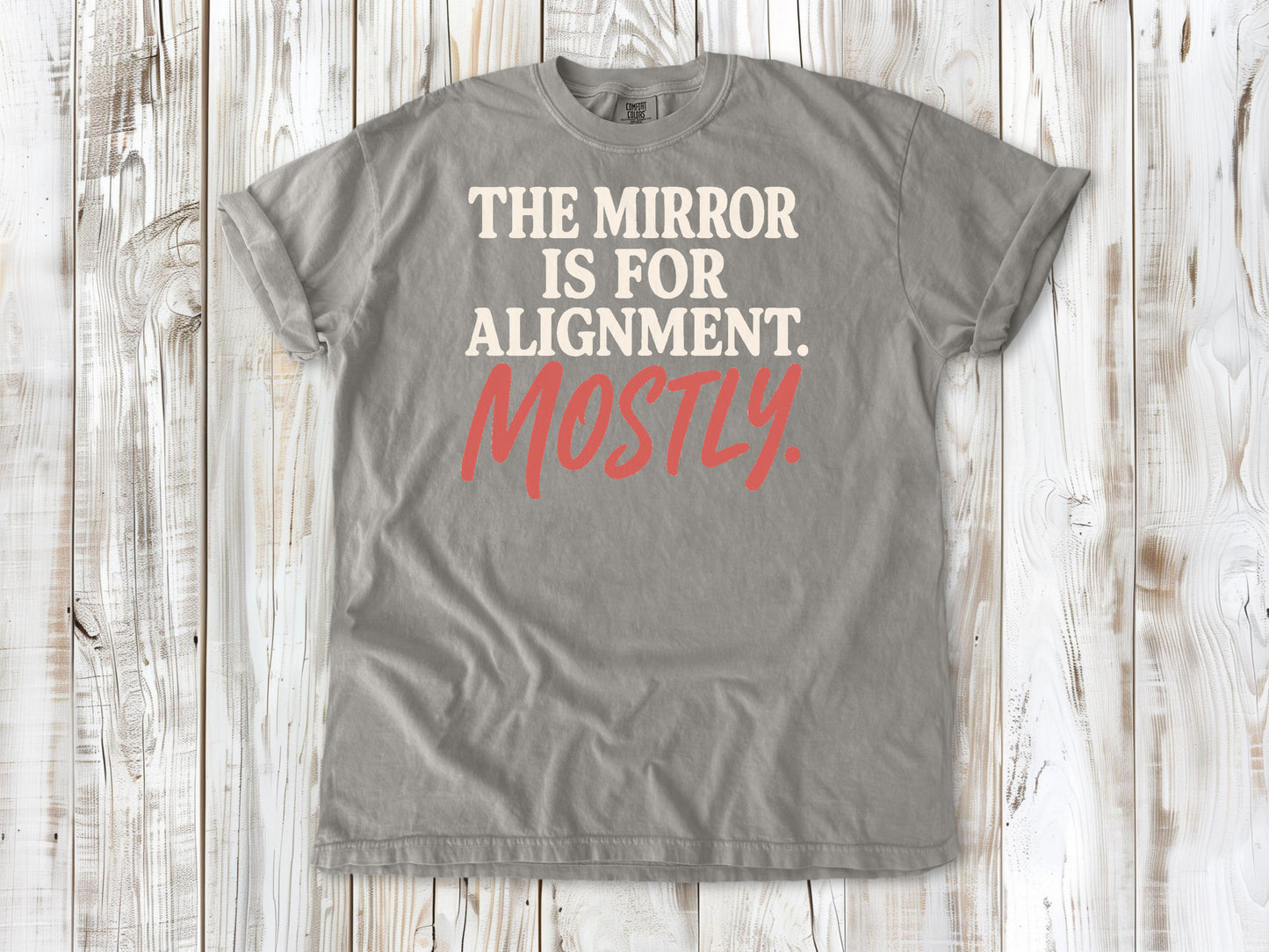 Grey garment-dyed tee with The Mirror Is for Alignment Mostly Pilates studio graphic.