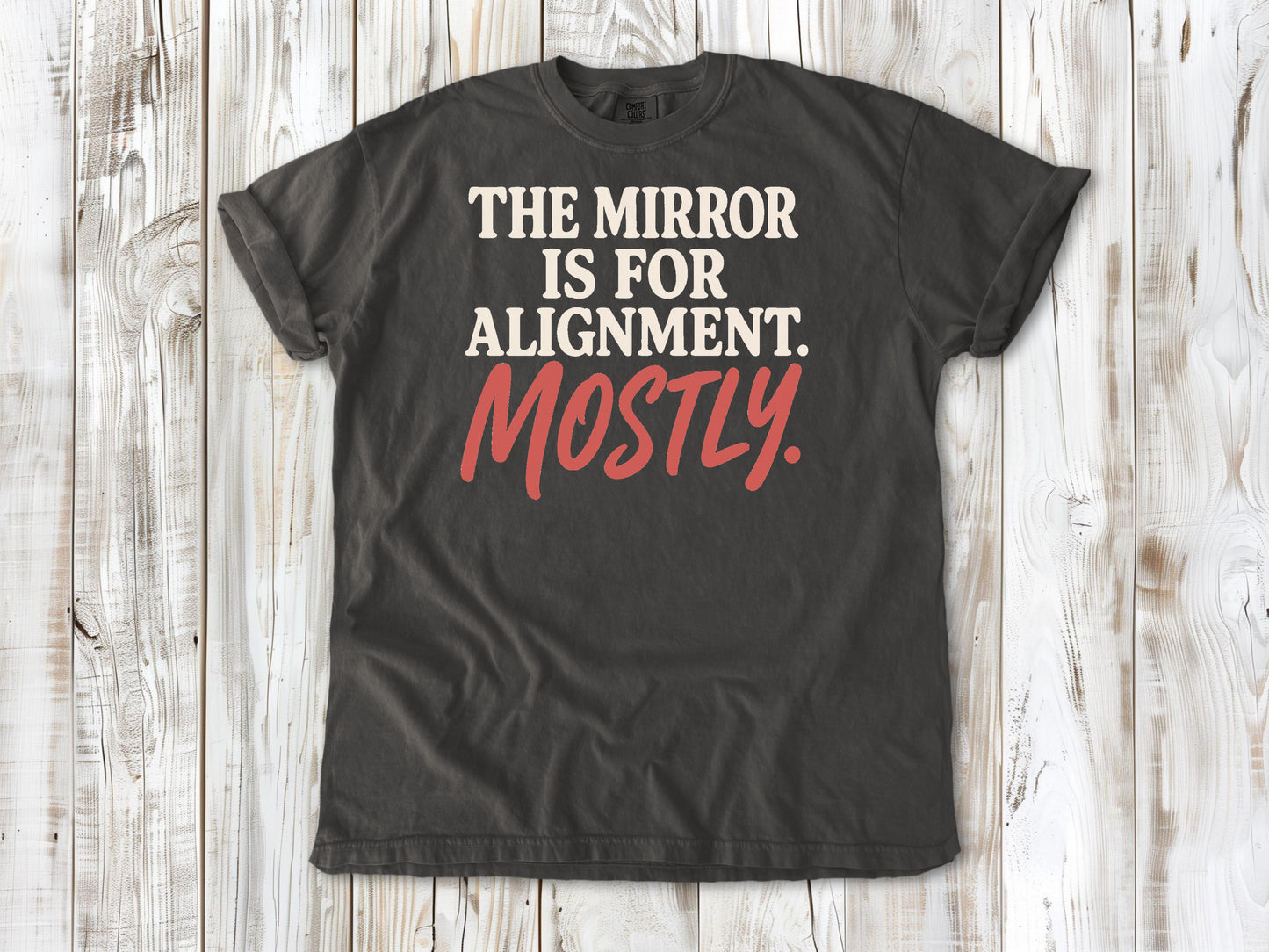 Pepper garment-dyed tee with The Mirror Is for Alignment Mostly Pilates studio graphic.