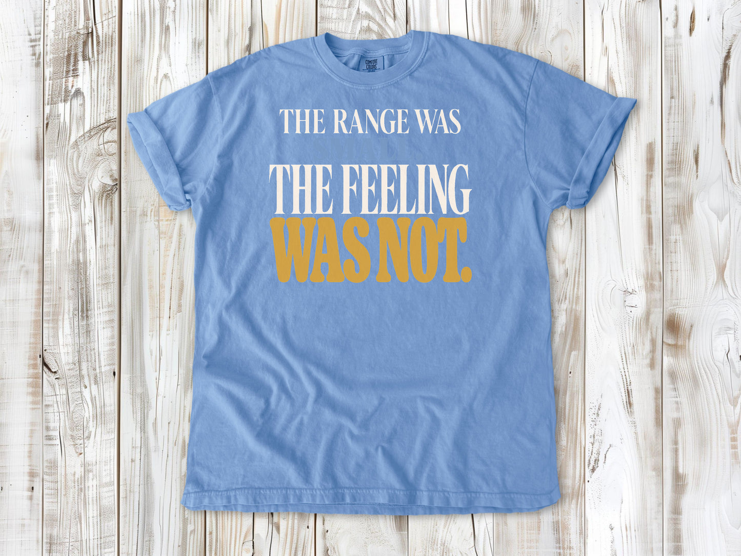 Washed Denim garment-dyed tee with The Range Was Small The Feeling Was Not Pilates graphic.