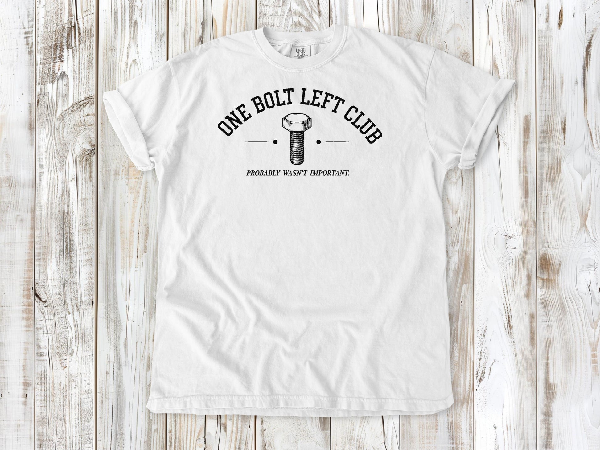 White garment-dyed tee with One Bolt Left Club mechanic humor graphic.