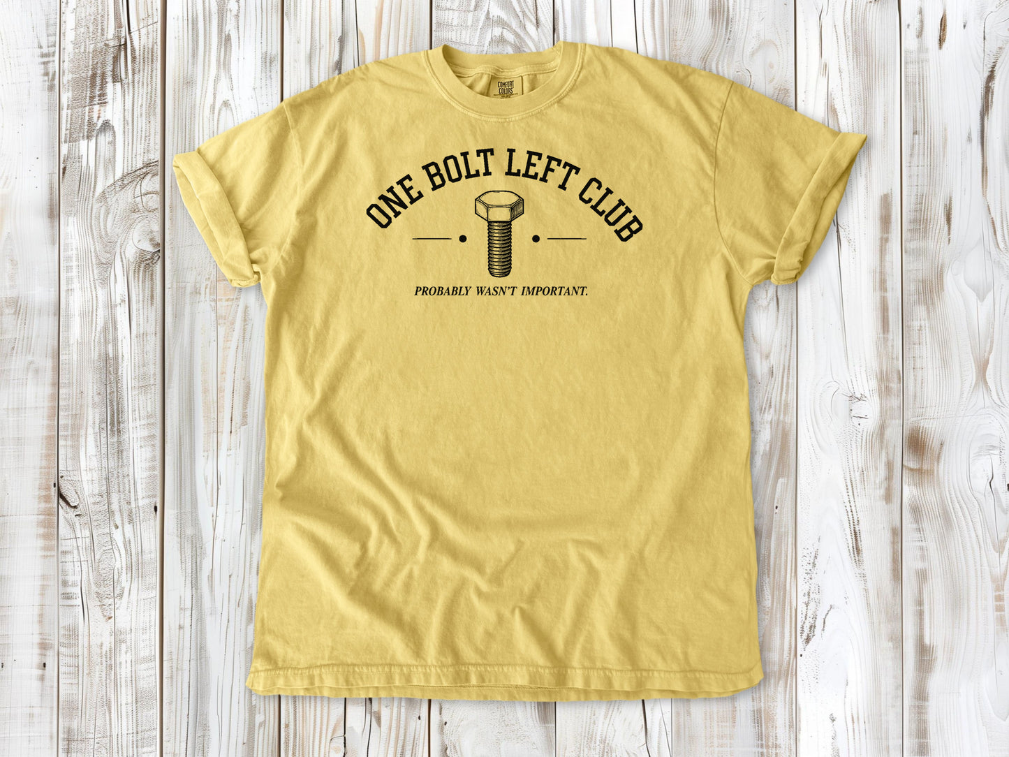 Butter garment-dyed tee with One Bolt Left Club mechanic humor graphic.