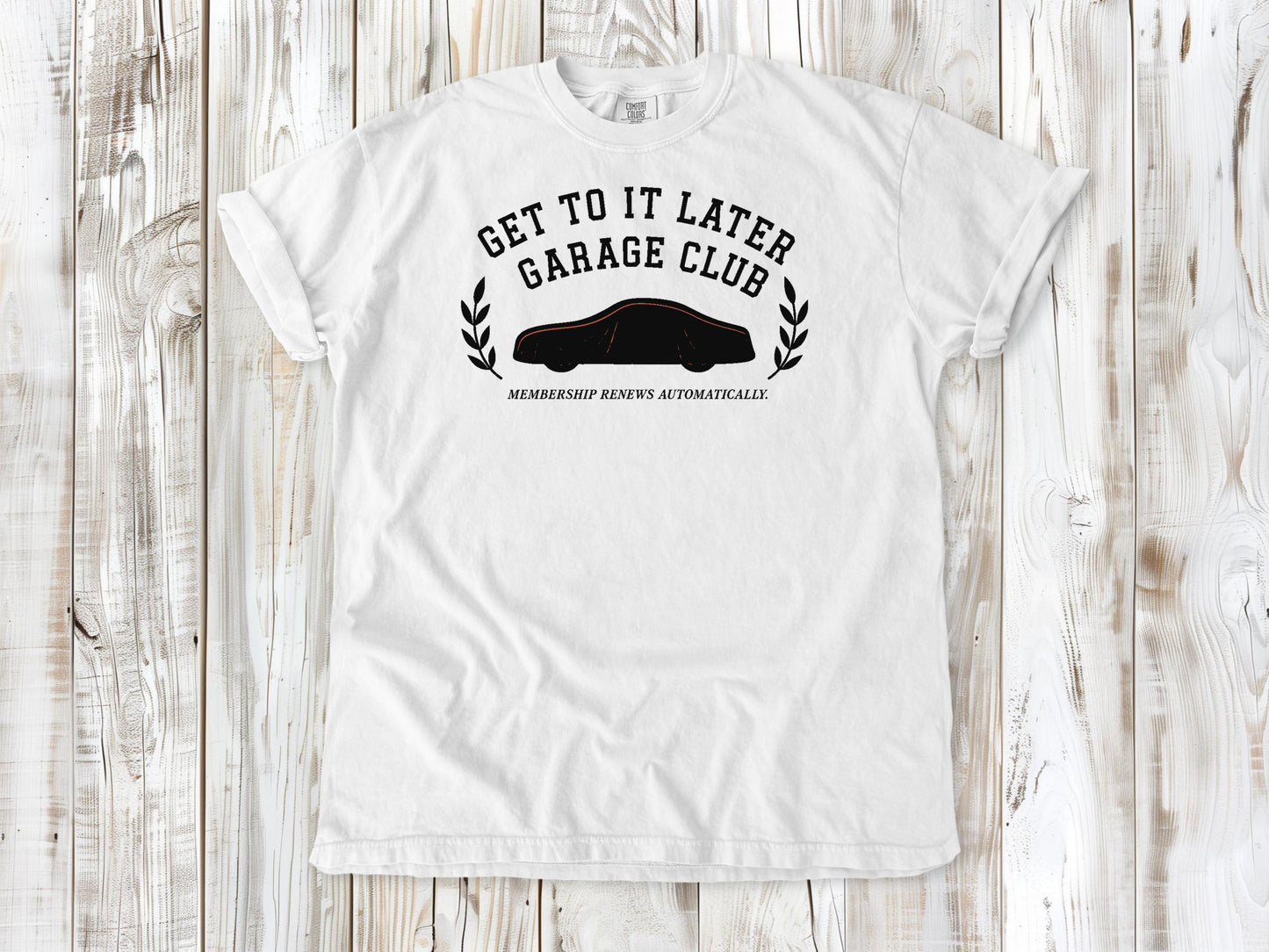 White garment-dyed tee with Get to It Later Garage Club project humor graphic.
