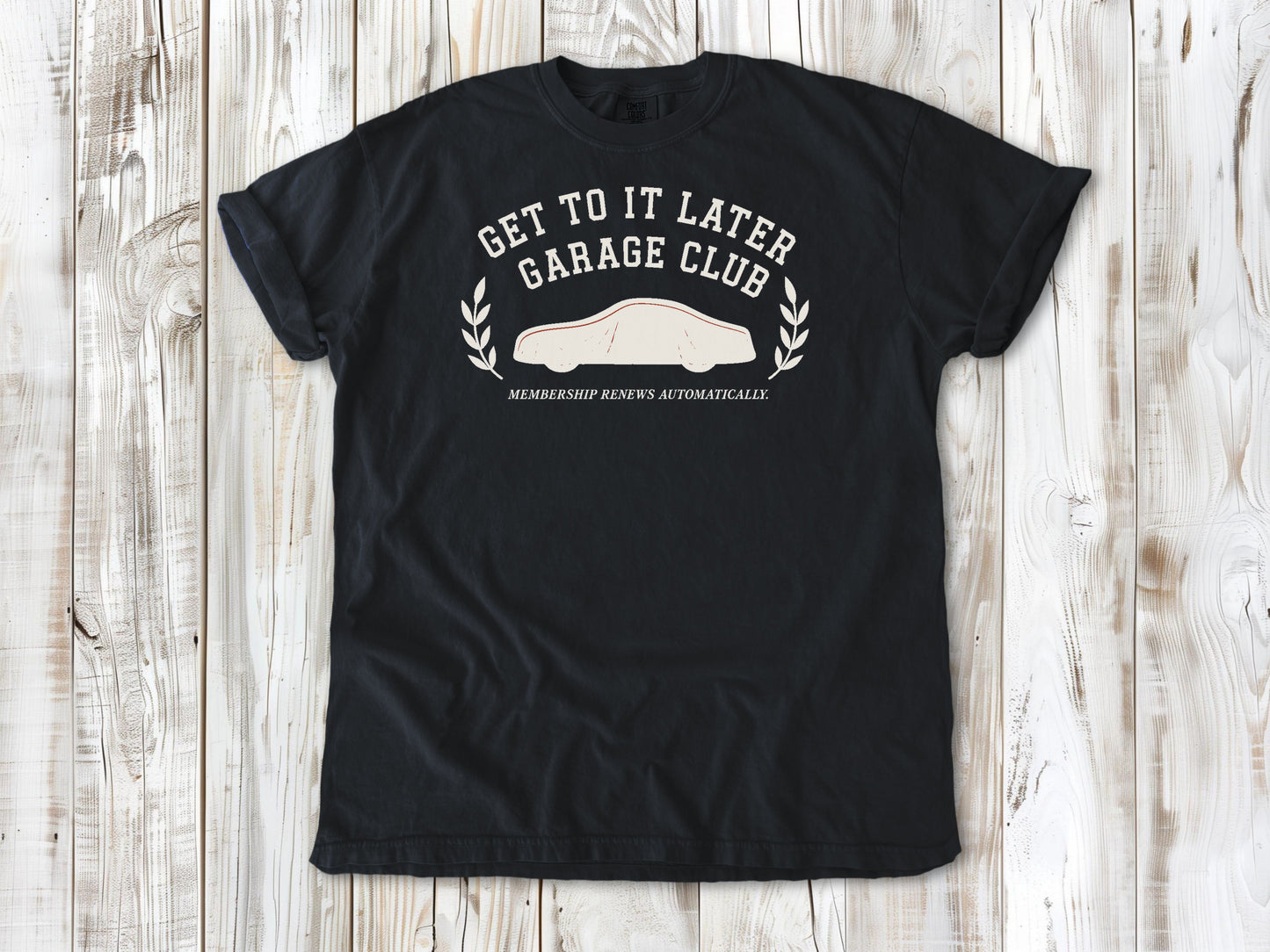 Graphite garment-dyed tee with Get to It Later Garage Club project humor graphic.