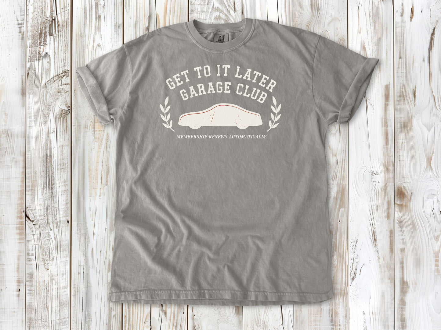 Grey garment-dyed tee with Get to It Later Garage Club project humor graphic.