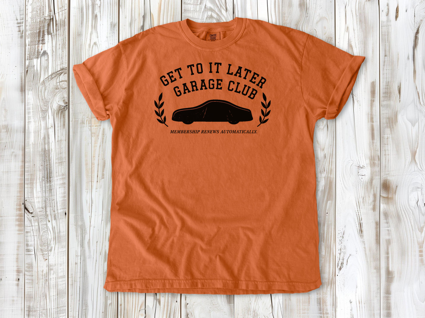 Burnt Orange garment-dyed tee with Get to It Later Garage Club project humor graphic.