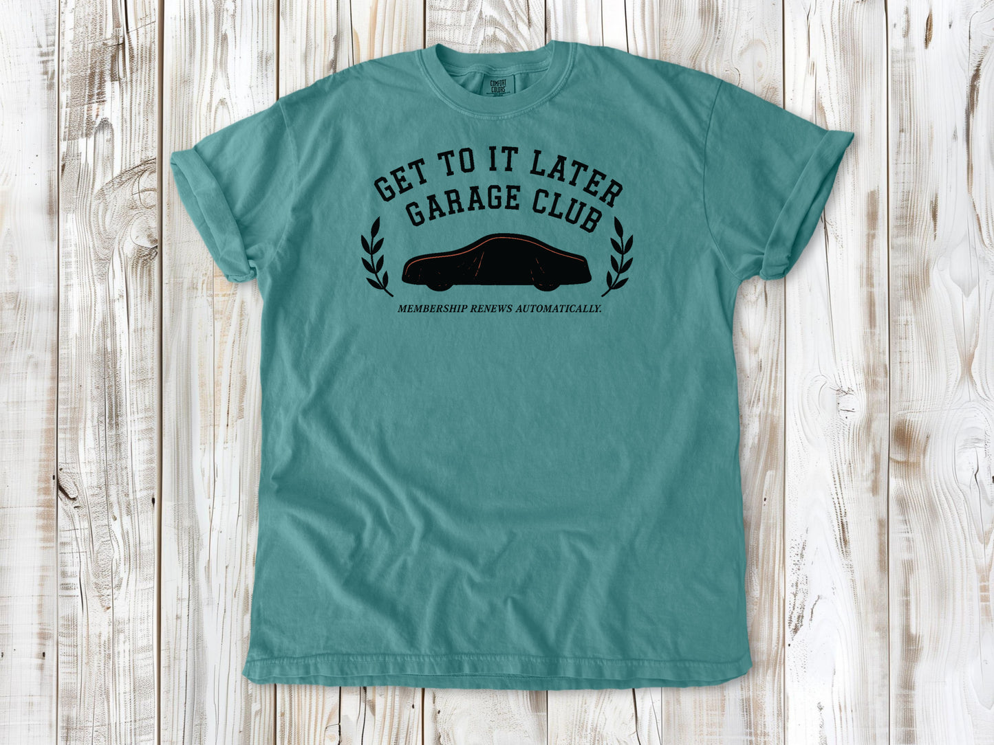 Seafoam garment-dyed tee with Get to It Later Garage Club project humor graphic.