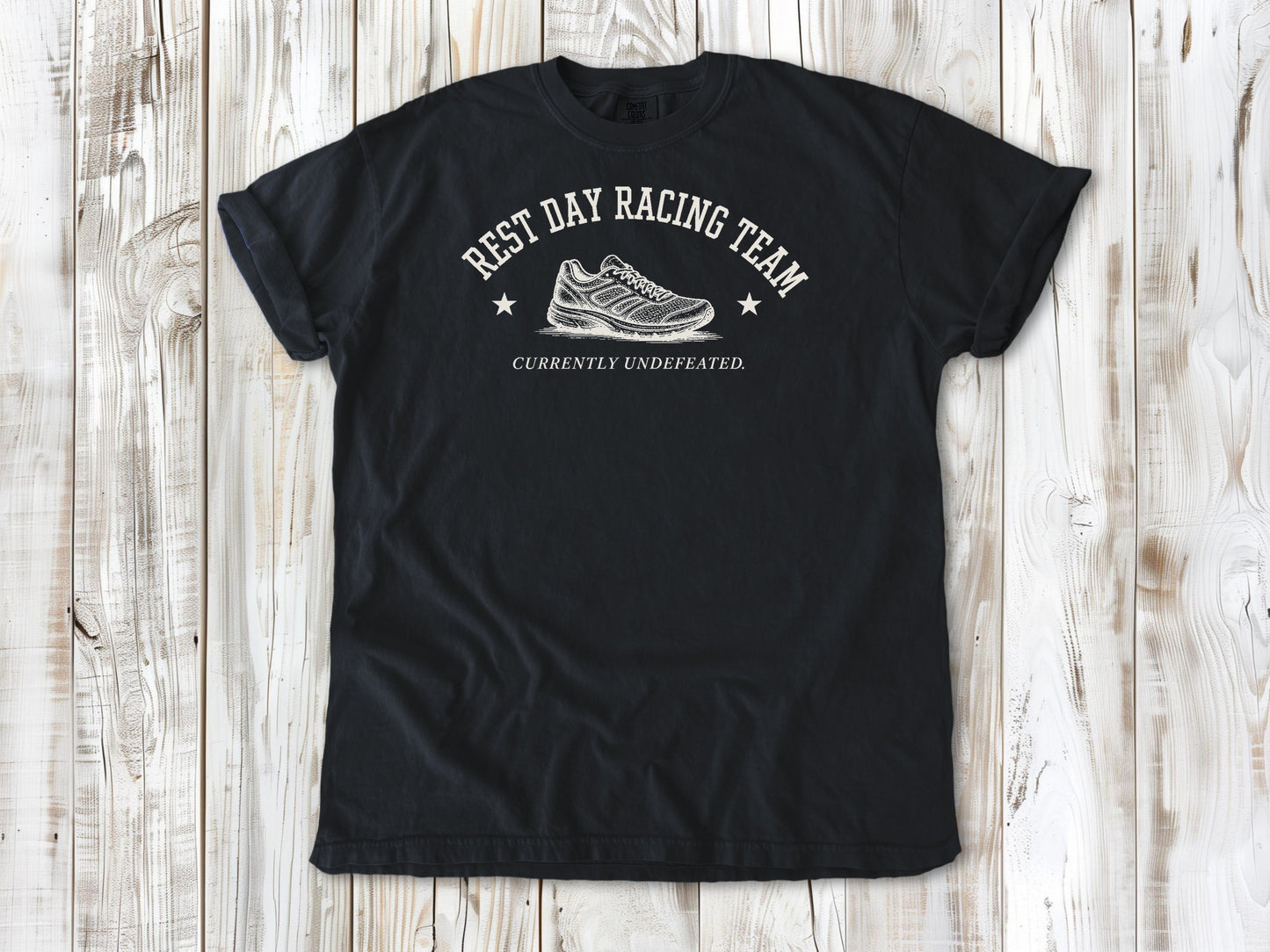 Graphite garment-dyed tee with Rest Day Racing Team running humor graphic.