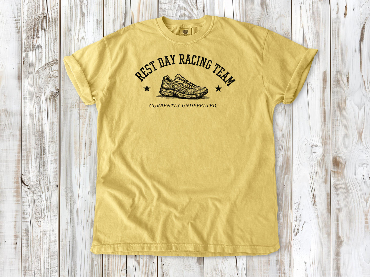 Butter garment-dyed tee with Rest Day Racing Team running humor graphic.