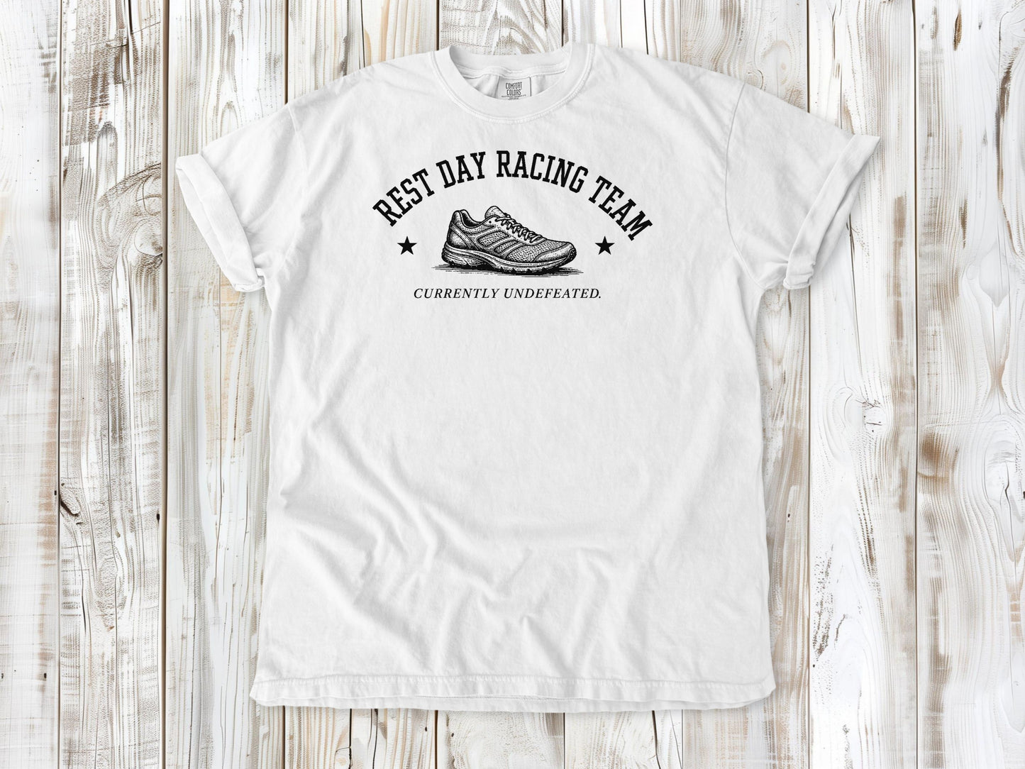 White garment-dyed tee with Rest Day Racing Team running humor graphic.
