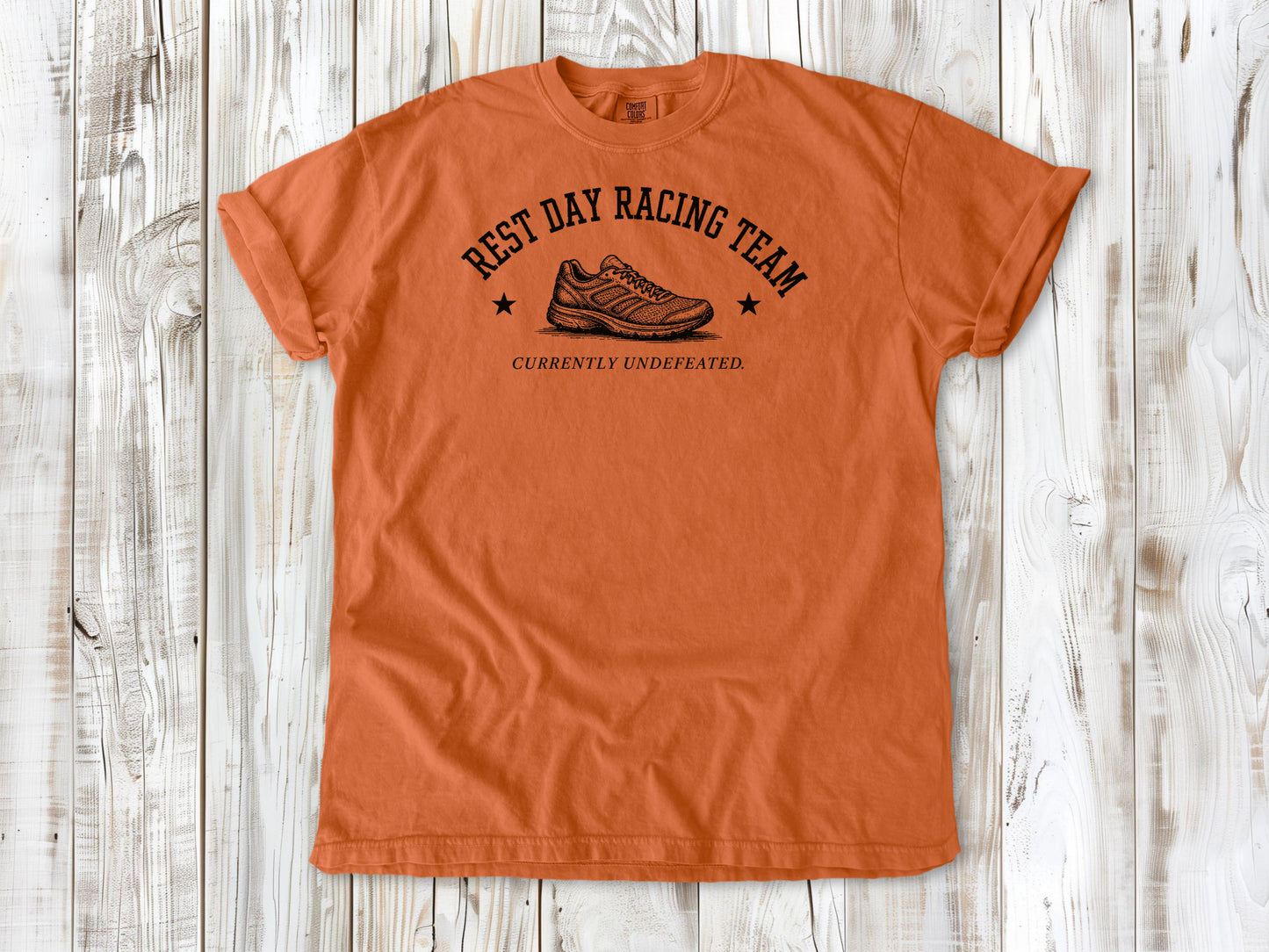 Burnt Orange garment-dyed tee with Rest Day Racing Team running humor graphic.