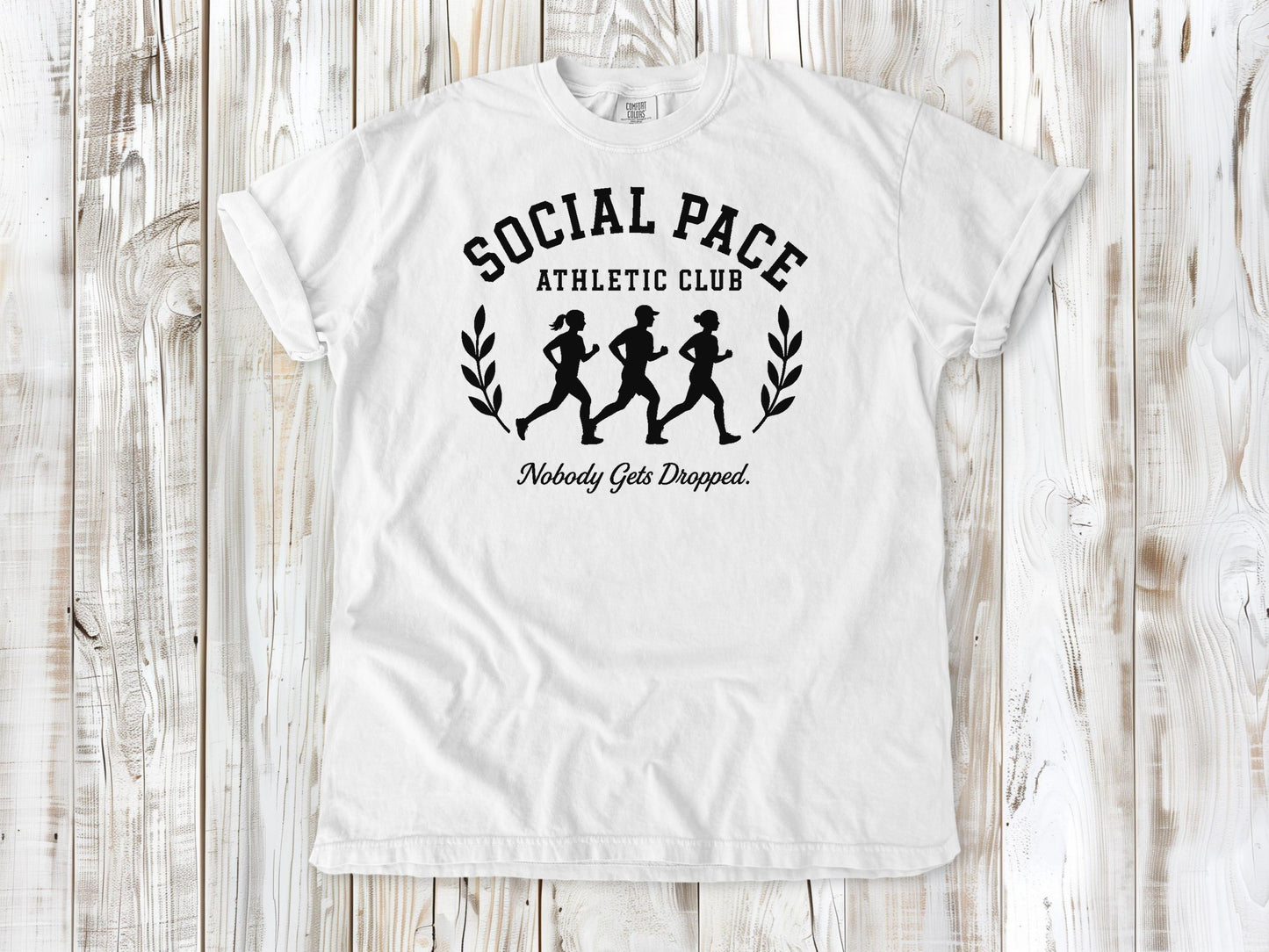White garment-dyed tee with Social Pace Athletic Club group running graphic.