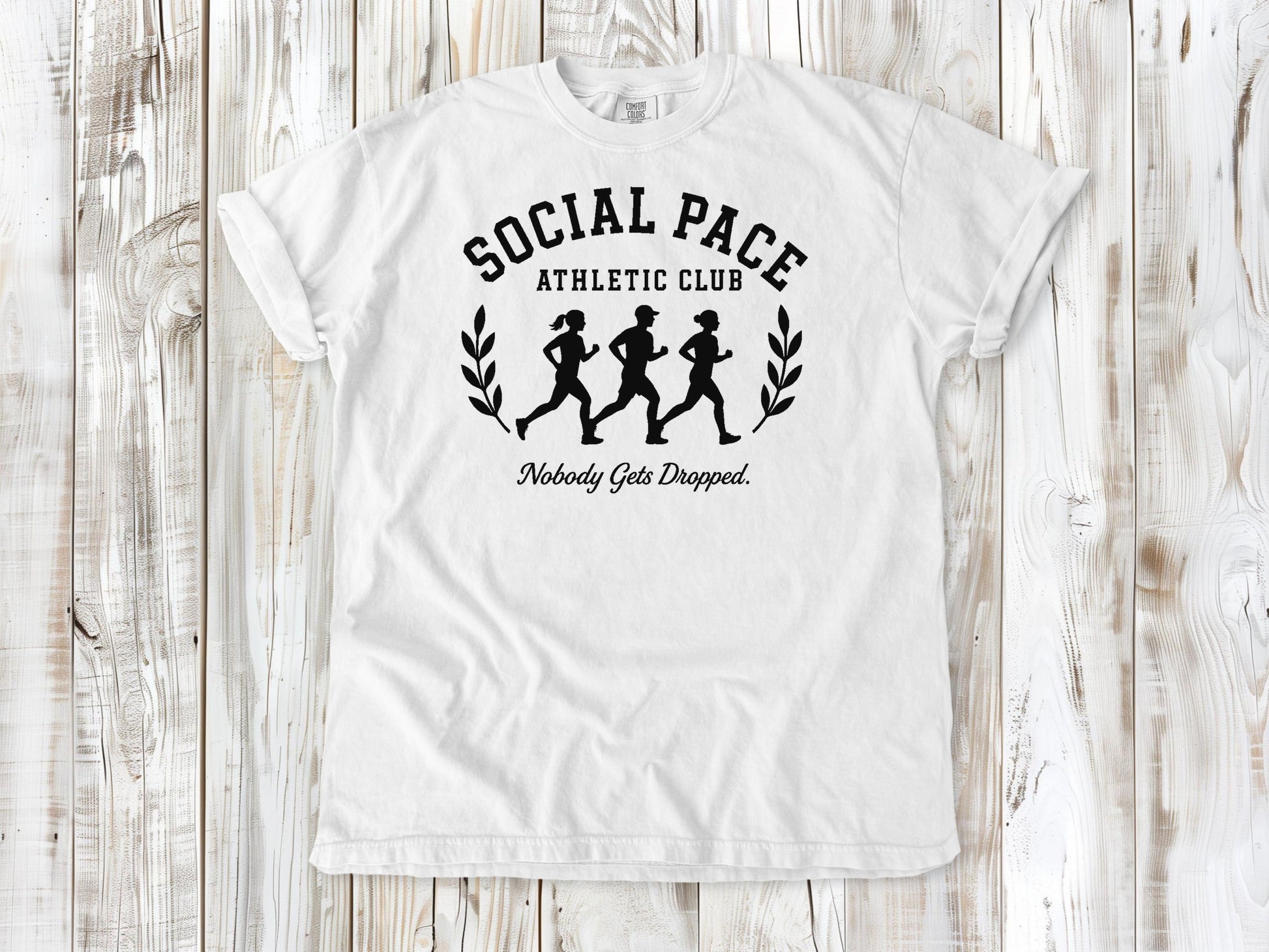 White garment-dyed tee with Social Pace Athletic Club group running graphic.