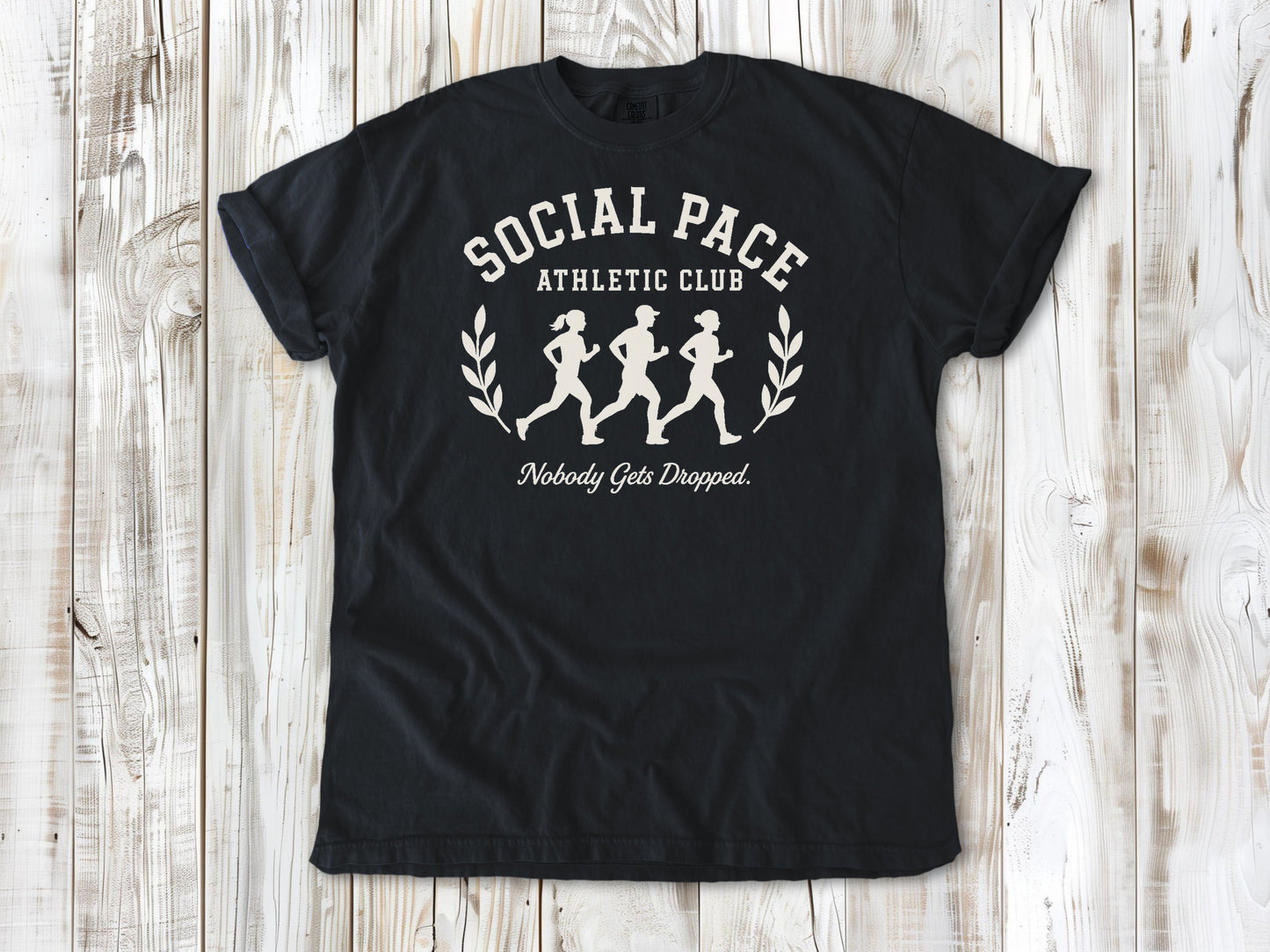 Graphite garment-dyed tee with Social Pace Athletic Club group running graphic.