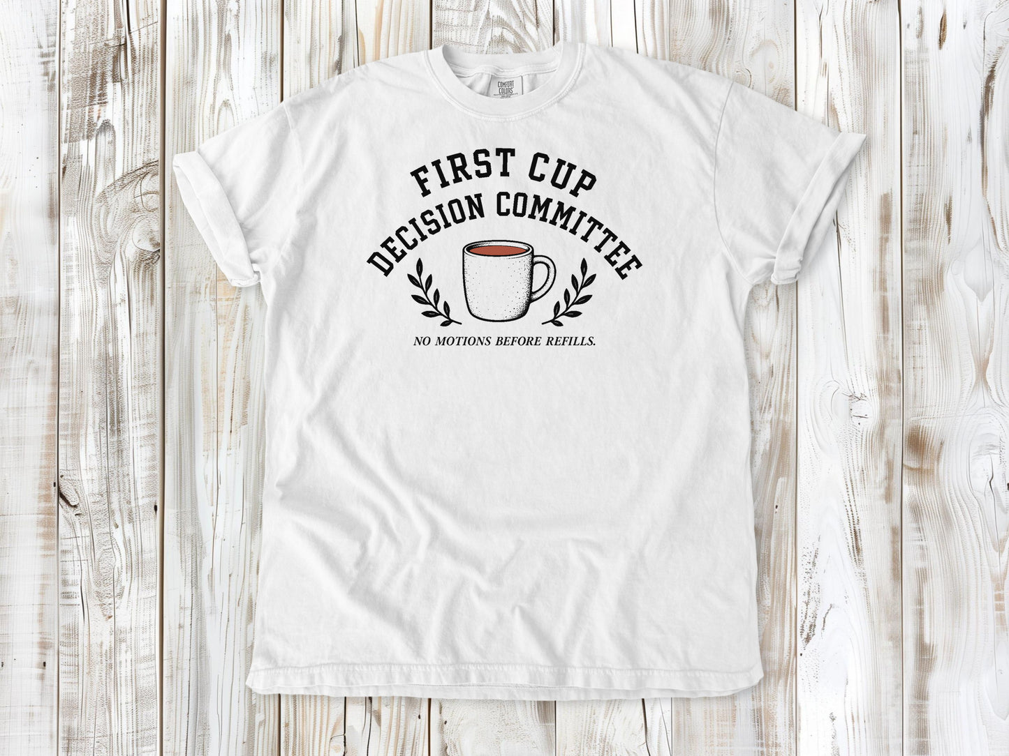 White garment-dyed tee with First Cup Decision Committee coffee club graphic.