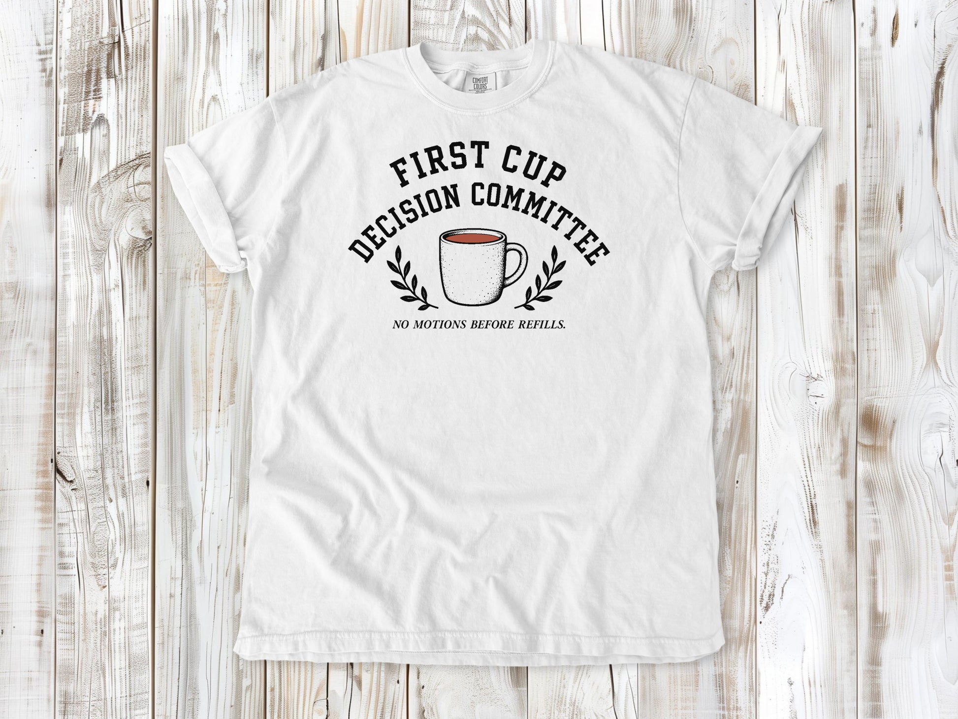 White garment-dyed tee with First Cup Decision Committee coffee club graphic.