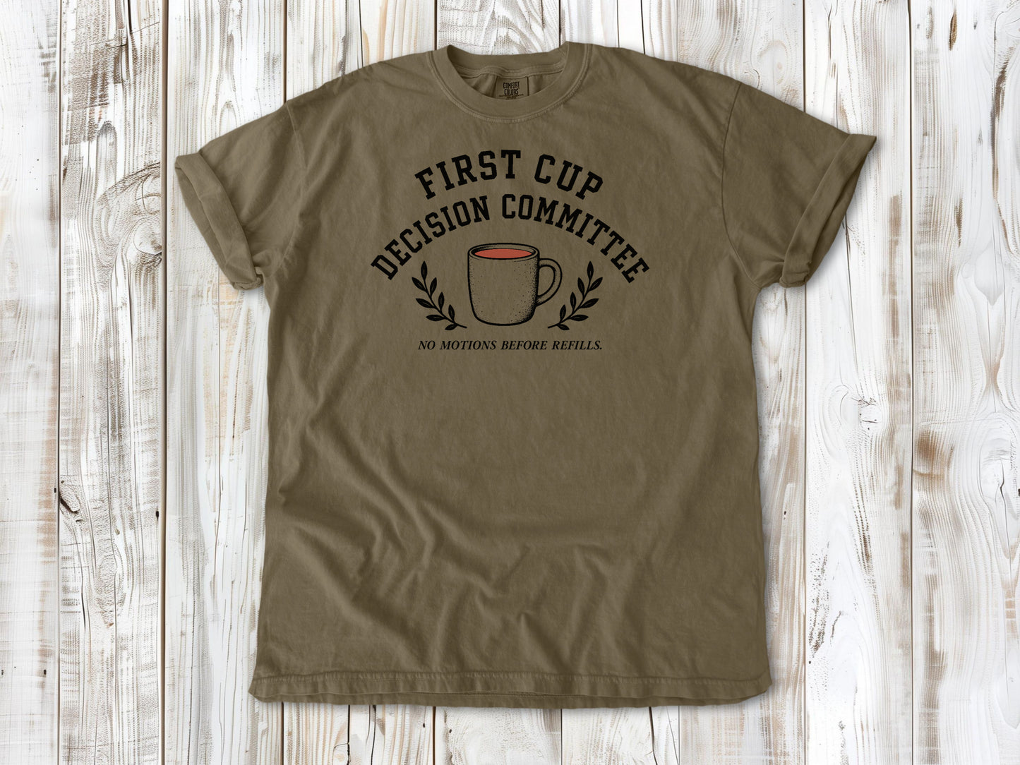 Khaki garment-dyed tee with First Cup Decision Committee coffee club graphic.