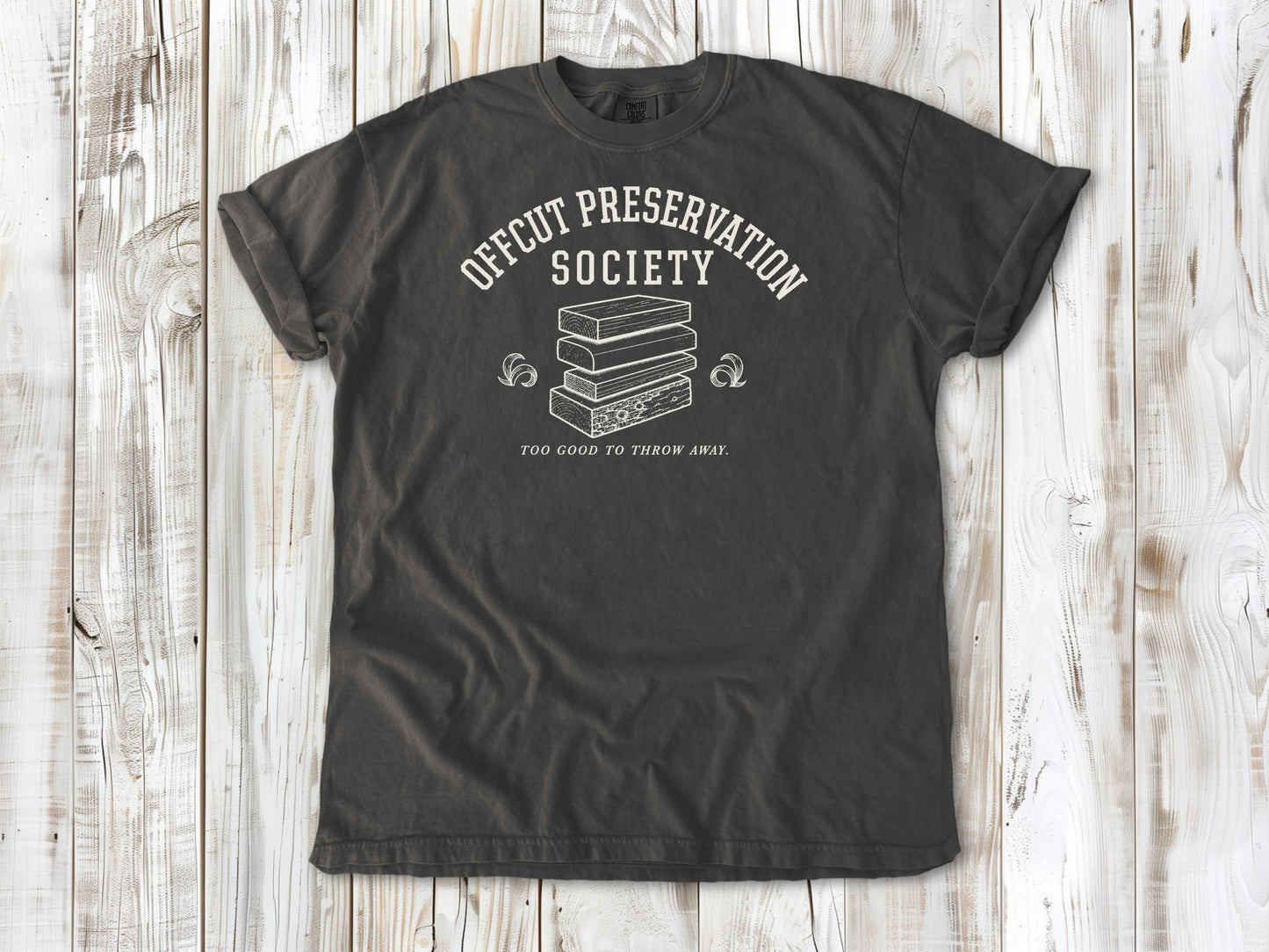 Pepper garment-dyed tee with Offcut Preservation Society woodworking graphic.
