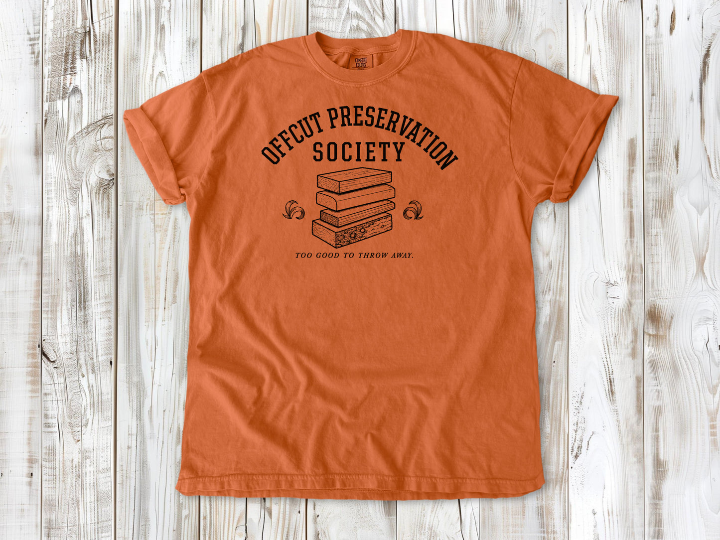 Burnt Orange garment-dyed tee with Offcut Preservation Society woodworking graphic.