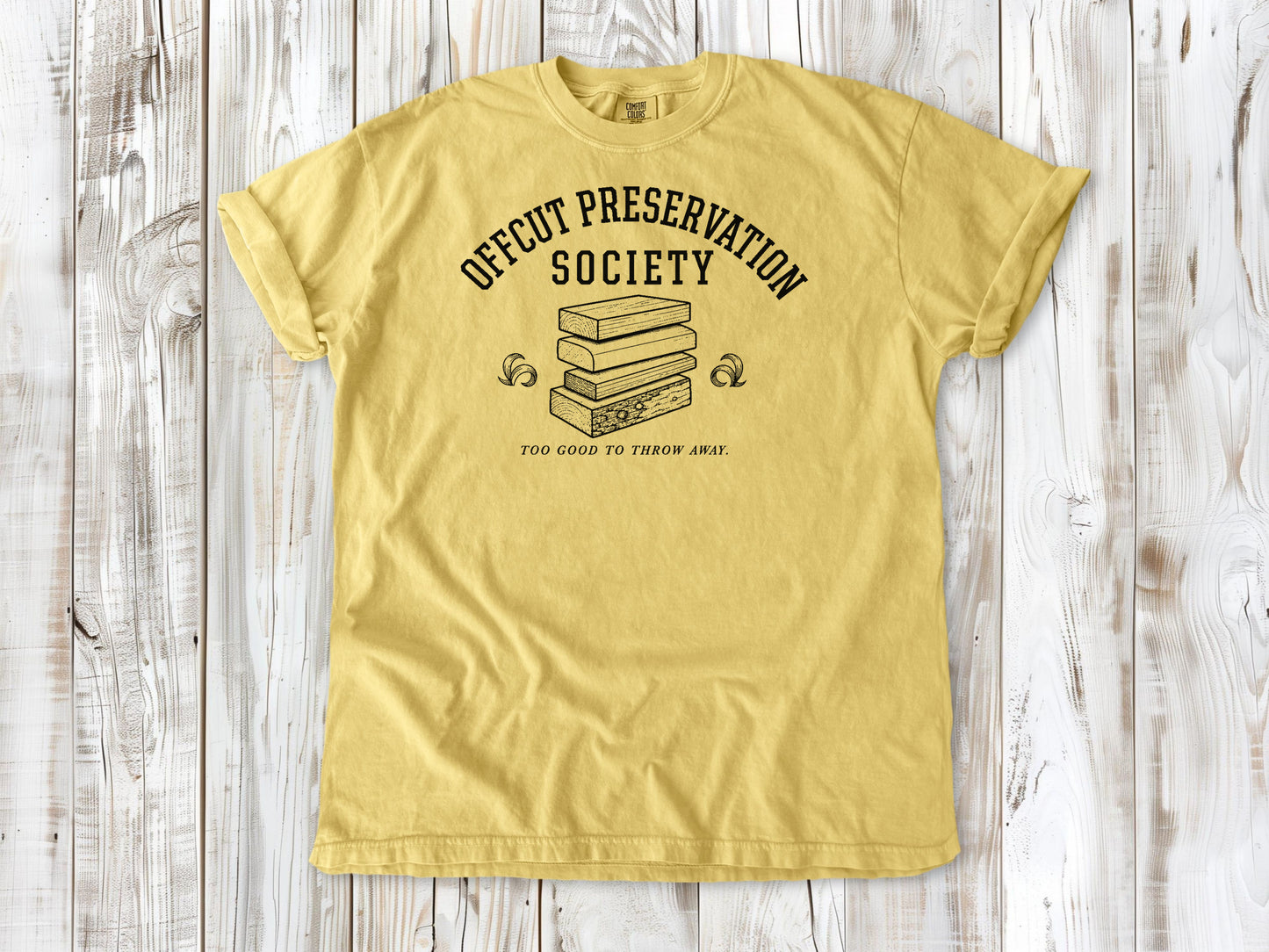 Butter garment-dyed tee with Offcut Preservation Society woodworking graphic.